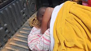 Two suspected lovers reportedly remain stuck inside rented room as terrified lodge manager calls elders and curious crowd blocks roadside entrance