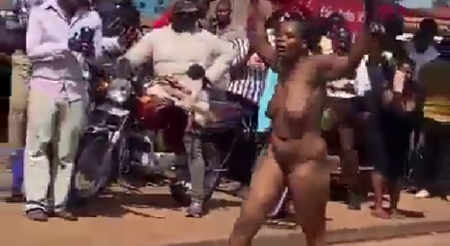 Woman who ran off with younger man spotted naked and dancing as crowd gathers in shock